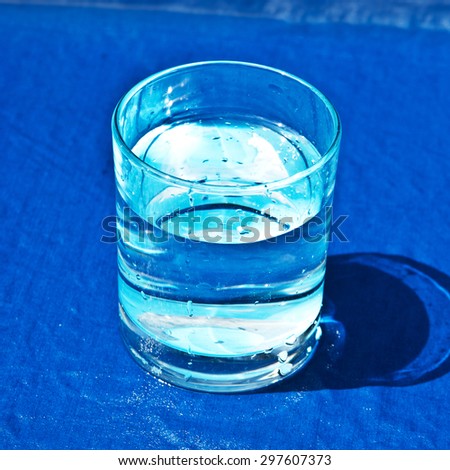The carafe with clean water on a blue background
