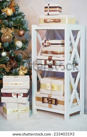 Shelf loaded with styled and wrapped present boxes