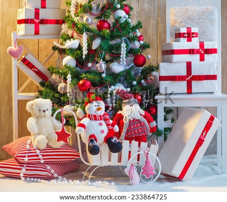 Christmas tree decoration with gift boxes and toys under it