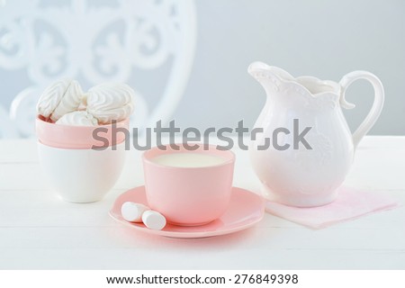 Sweet still life with candy colors porcelain crockery, milk and marshmallows