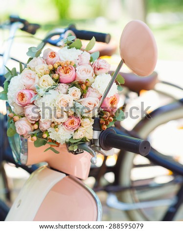Wedding decoration details, closeup of flower bouquet on retro bike handle bar