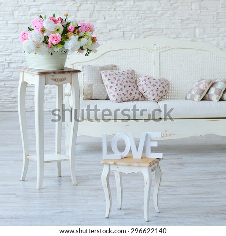 Interior with vintage furniture elements, love letters and decorative flowers