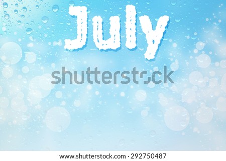 July month cloud message on water drops bokeh sign background