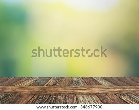 Empty wooden deck floor with natural bokeh background. Product display template.