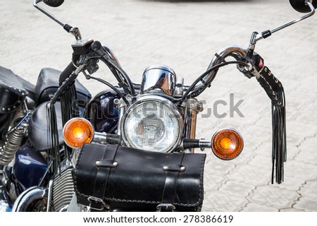 View of classic cruise motorcycle with a bag in the front