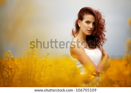young beautiful girl in the field
