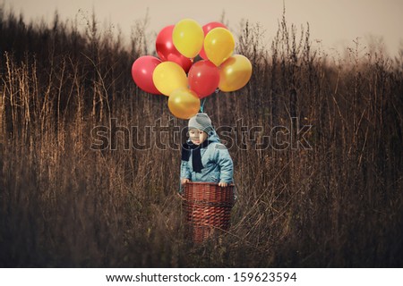 little boy wants to fly on balloons away