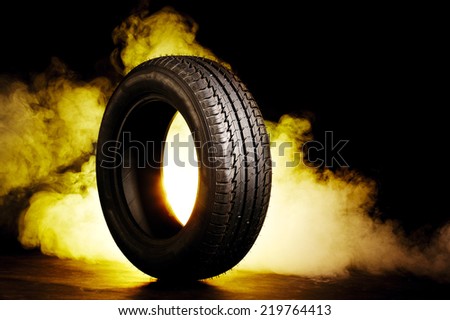 photo of black smoked and burning tire