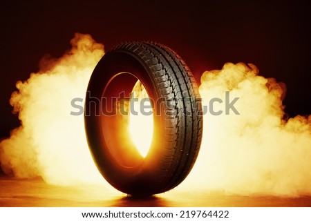 photo of black smoked and burning tire