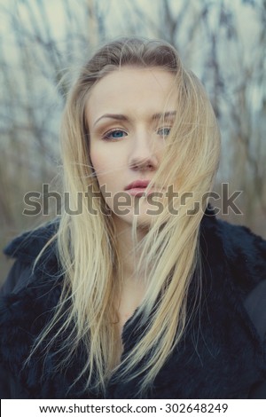 portrait of beautiful girl on windy day