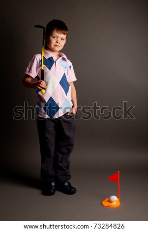Little Boy Golfing