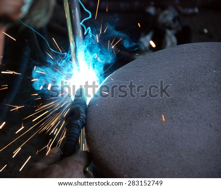 picture of a process of welding. sparks and heat