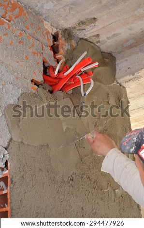 Installing power outlets. Power sockets on initial stage of construction