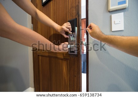 locksmith team fix smart lock on wood door by screwdriver - can use to display or montage on product