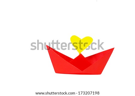 Red paper ship with heart shape