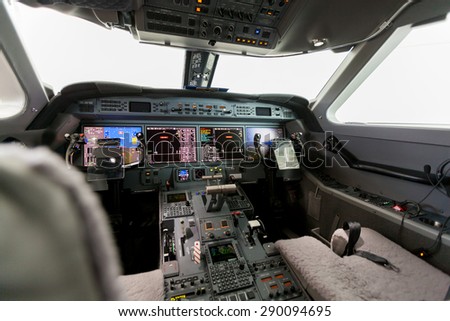 Inside view Cockpit Airplane Aircraft with blue sky and clouds