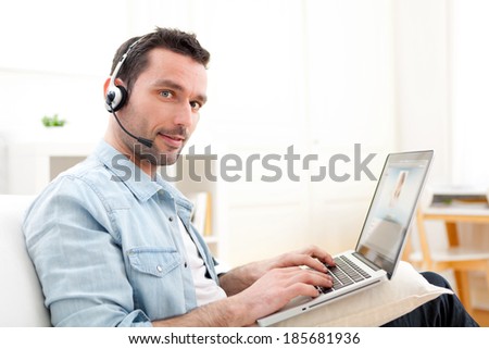 View of a Young relaxed man video-calling on Internet