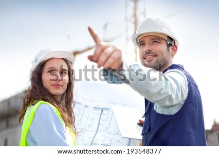 View of Co-workers working on a construction site