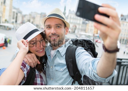 View of a Young couple on holidays taking selfie