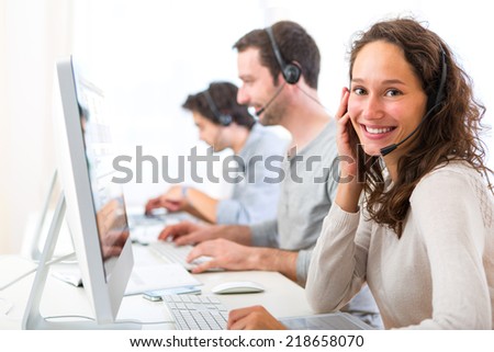 View of a Young attractive woman working in a call center