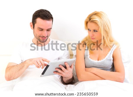 View of a Young woman bored while her boy reading news