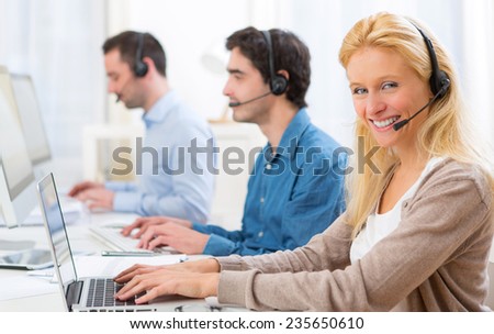 View of a Young attractive woman working in a call center