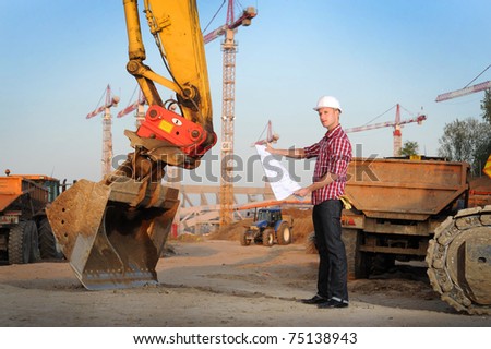 Young architect working on location on a construction site
