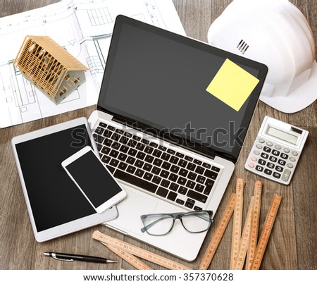 View of a Wood architect\'s desk in high definition with laptop, tablet and mobile