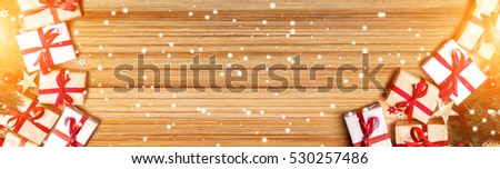 Christmas wooden background banner with tree, gift and decoration