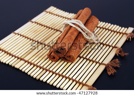 Two cinnamon sticks isolated on white background. Close up.