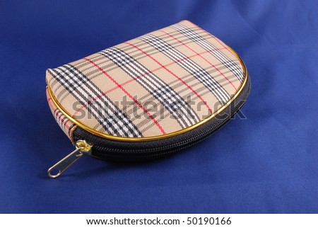 Bag for cosmetics with figure on a dark blue background