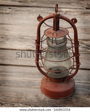 Vintage kerosene  lamp on a wooden table