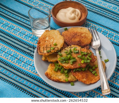 Traditional Ukrainian homemade potato pancakes potato with sour cream