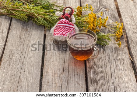 Drink from tansy and folk doll as the concept of traditional medicine