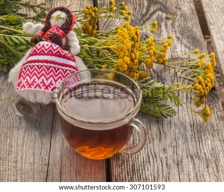 Drink from tansy and folk doll as the concept of traditional medicine
