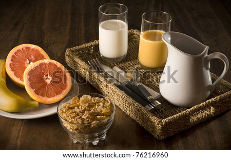 Healthy breakfast with fruit, cereals and milk.