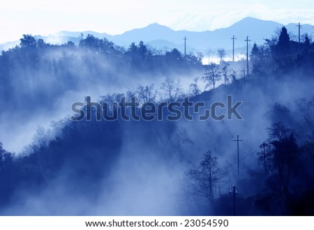 an Italian landscape in the fog