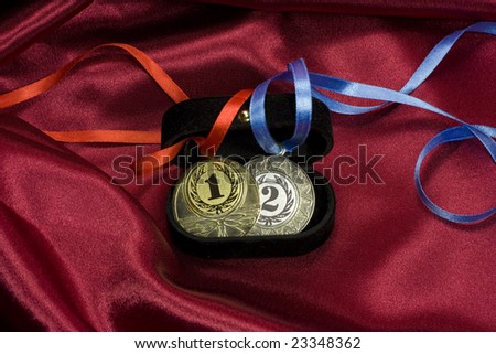 Gold and silver medals in the box