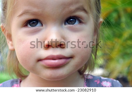 Little girl pulling funny faces and making funny noises