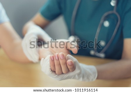 Doctor hand Physicist physical therapy treatment patient in the clinic.Orthopedic medical exam in doctor's hospital office Partnership, traumatology and medical consultation for hand wrist injury