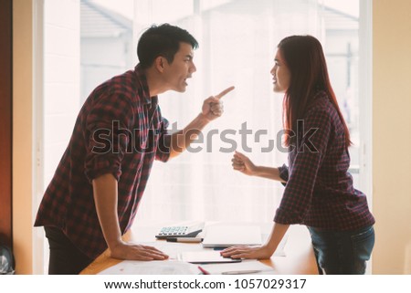 Negative emotions of couples concept. Asian People \
Thai in the fight. Husband and wife arguing and yelling expressive and emotional couple having an argument or the quarrel at home