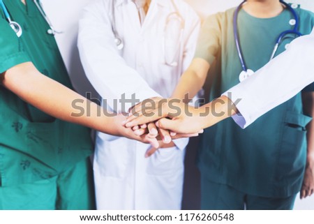 Doctor and nurse coordinate hands. Concept Teamwork, happy doctors working together as team for motivation, success medical health care