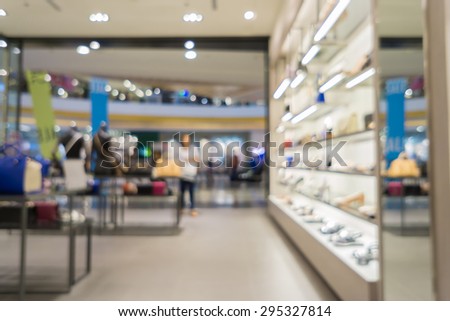 Blur of city shopping people crowd at marketplace shoe shop abstract background.