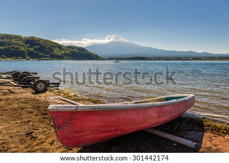 Boat and Mount Fuji from Kawaguchiko in march.Snow-capped Mount Fuji with clear sky background.