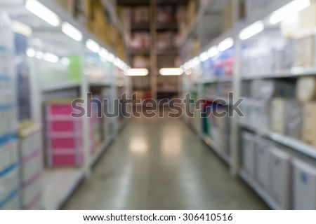 Blurred abstract background of people shopping in super market  : Shoppers in grocery store in a gangway : Walkway with full with goods and products on shelves in super market