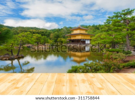 Wood table top with Blur background  Miromachi Zen at serene.Kinkakuji Temple,kyoto,Japan(The Golden Pavilion) - can be used for montage or display your products