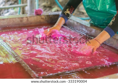 Blurred motion,How to make the process of mulberry paper / fabric. Arts and crafts.Making paper sheets from mulberry pulp, near Chiang Mai Thailand.