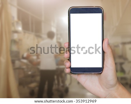 closeup of man with smart phone, Man hand holding mobile smart phone , tablet,cellphone over Blurred of Patient lying on a hospital bed waiting for the emergency treatment of a doctor background.