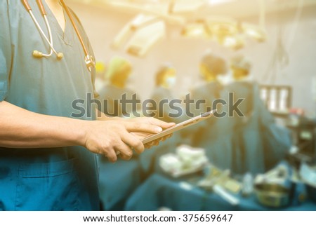 Male doctor,medical students or surgeon using digital tablet and laptop during the conference,Health Check with digital system support for patient,test results and patient registration,selective focus