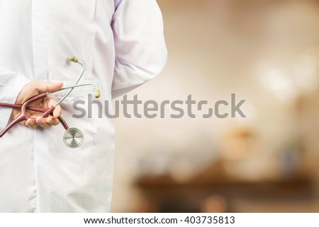 male doctor holding a stethoscope in a hospital,medical students during the conference,Health Check with digital system support for patient,test results and patient registration,selective focus